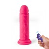 Vibratore senza fili realistico fucsia con telecomando wireless e ventosa per stimolazione intensa.